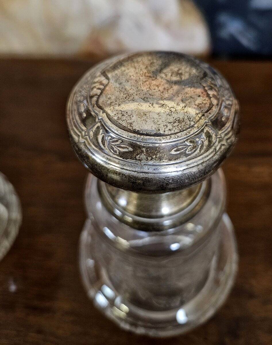 Pair of antique Louis XVI style bottles in finely engraved crystal and silver.