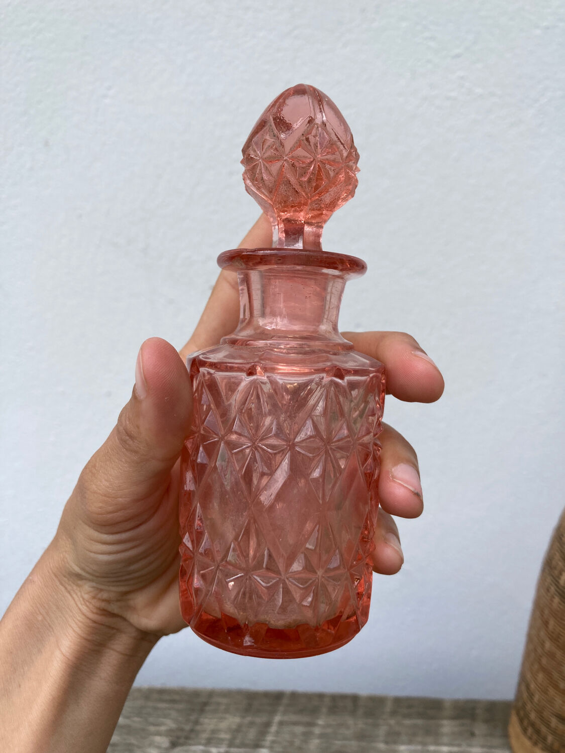Art Deco perfume bottle in old amber pink glass