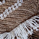 Cushion cover in natural raffia, shells and embroidery in macramé.