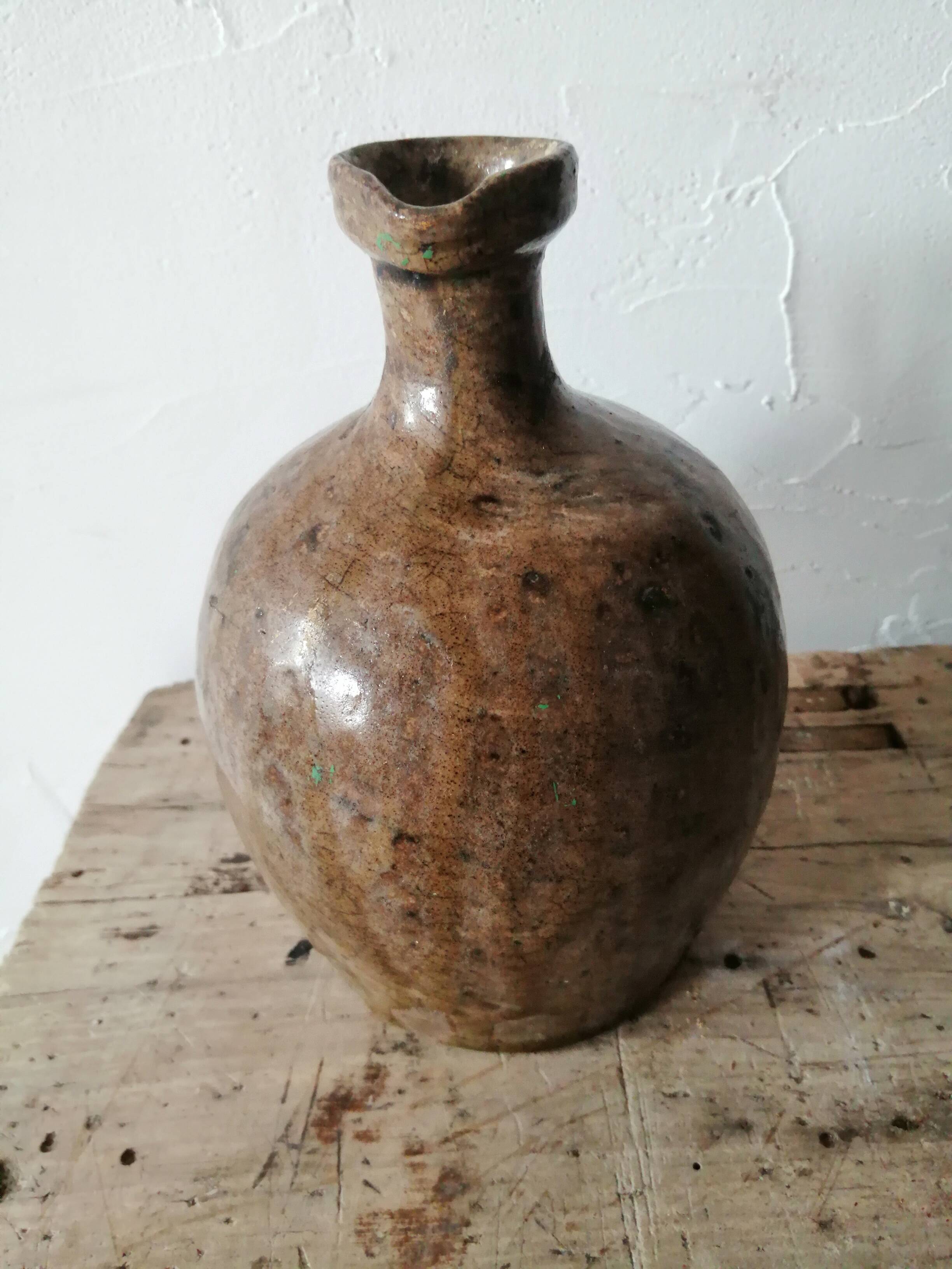 Small very old glazed jug