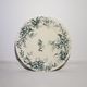 Flat plate of the earthenware factory of Salins model Cyclamen, iron earth.
