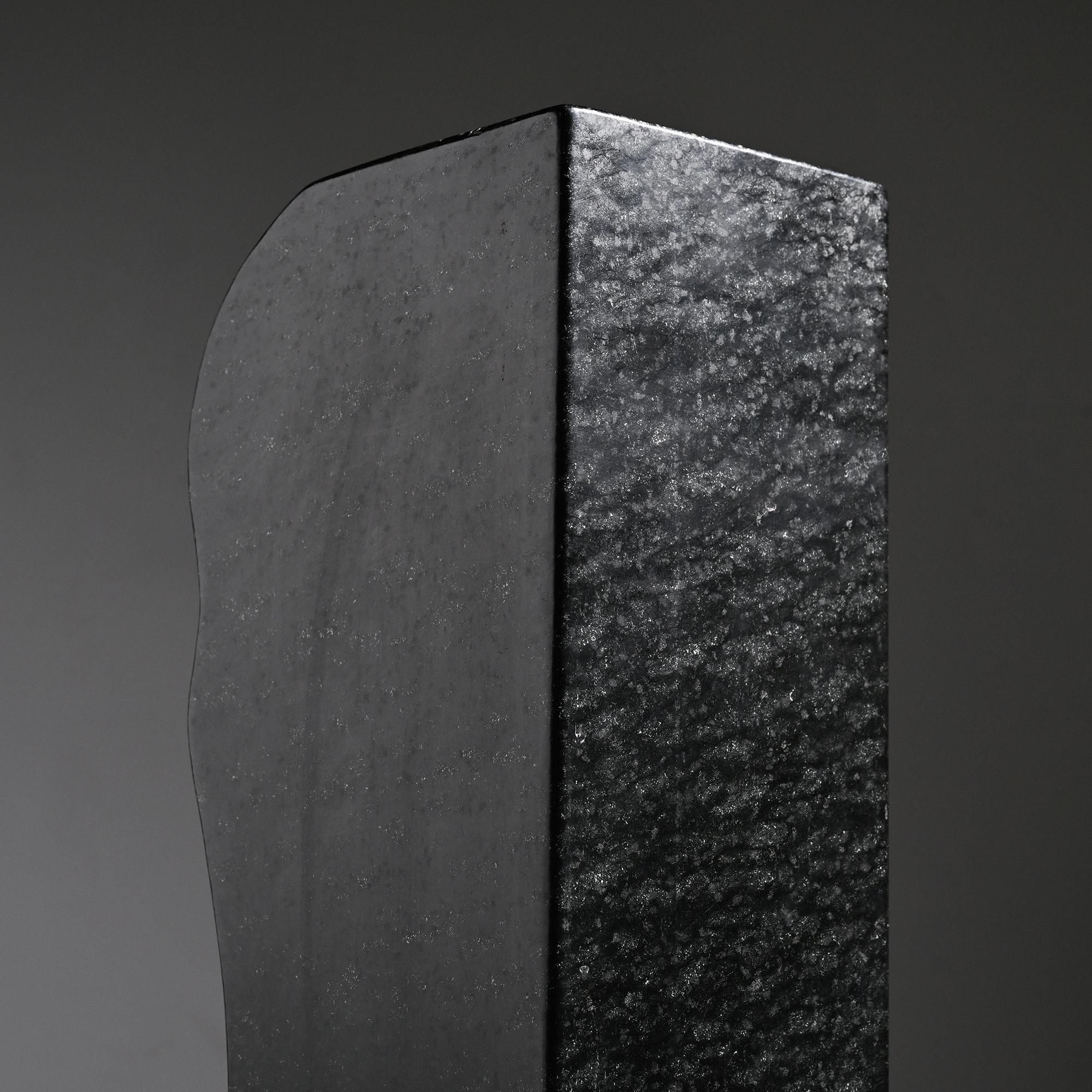 Abstract sculpture in diabase by Robert Neuhauser, Switzerland, circa 1985.