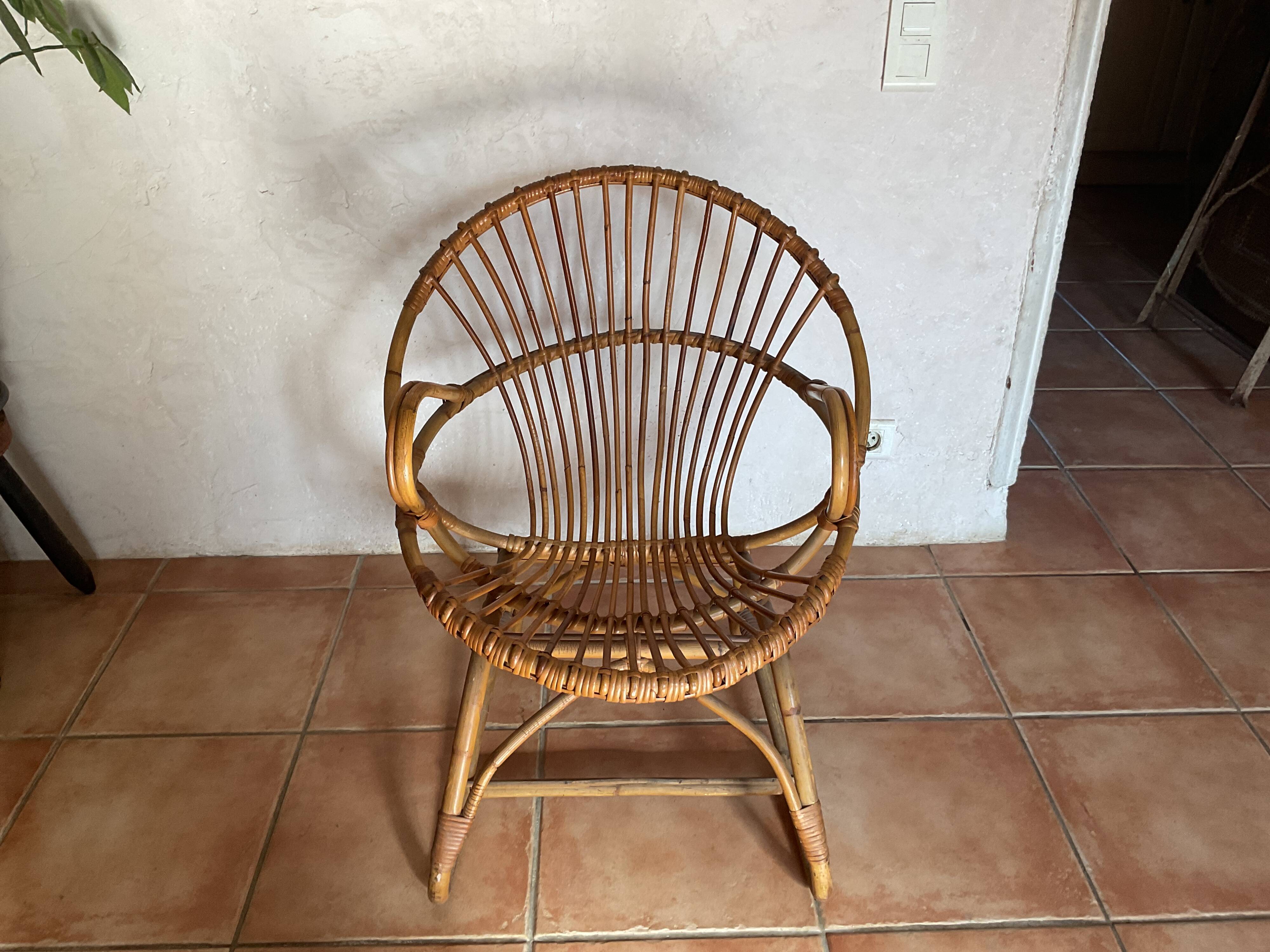 Rattan armchair with vintage design armrests