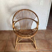 Rattan armchair with vintage design armrests