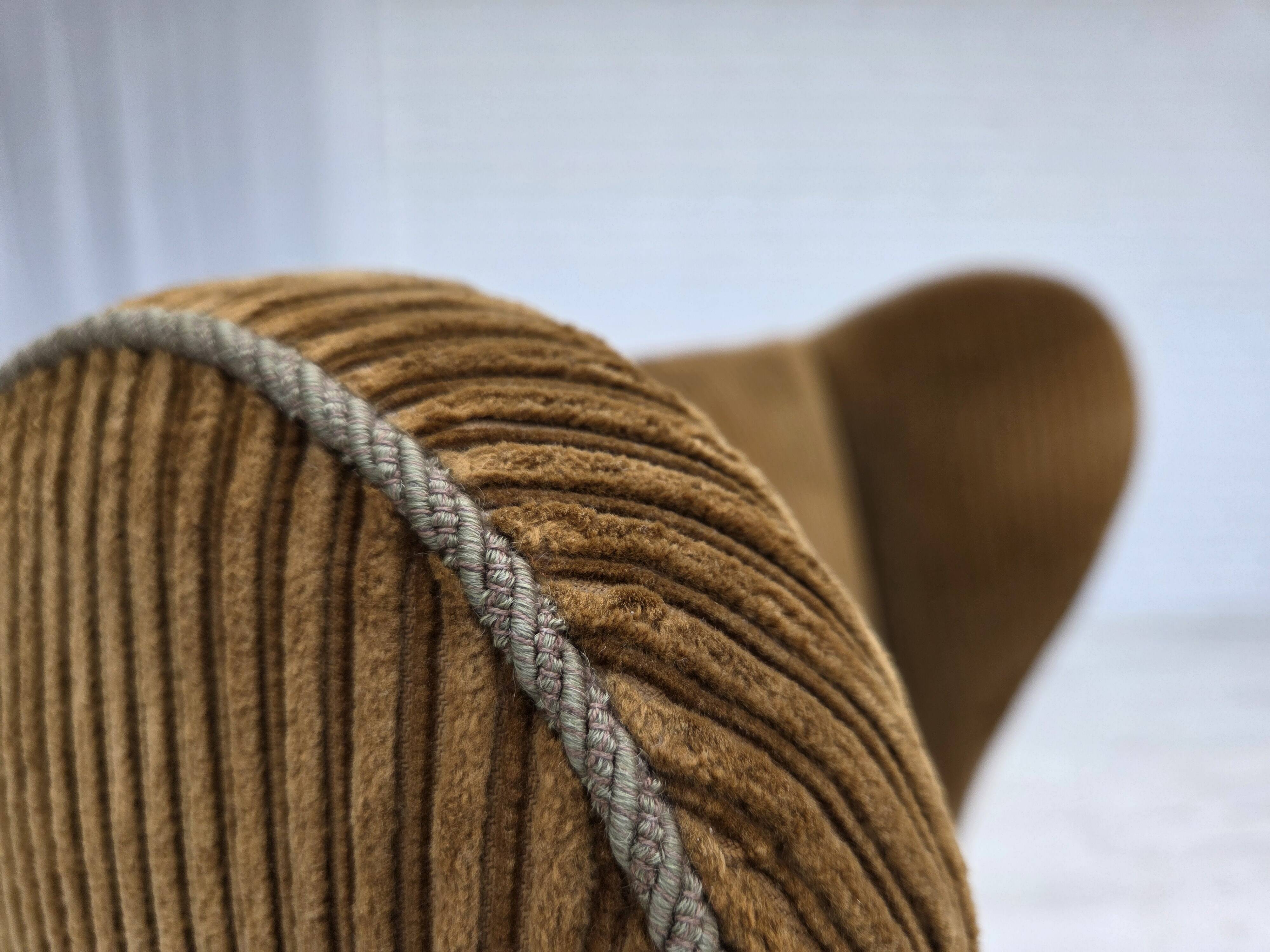 1970s, Scandinavian highback armchair, furniture corduroy, carved oak wood.