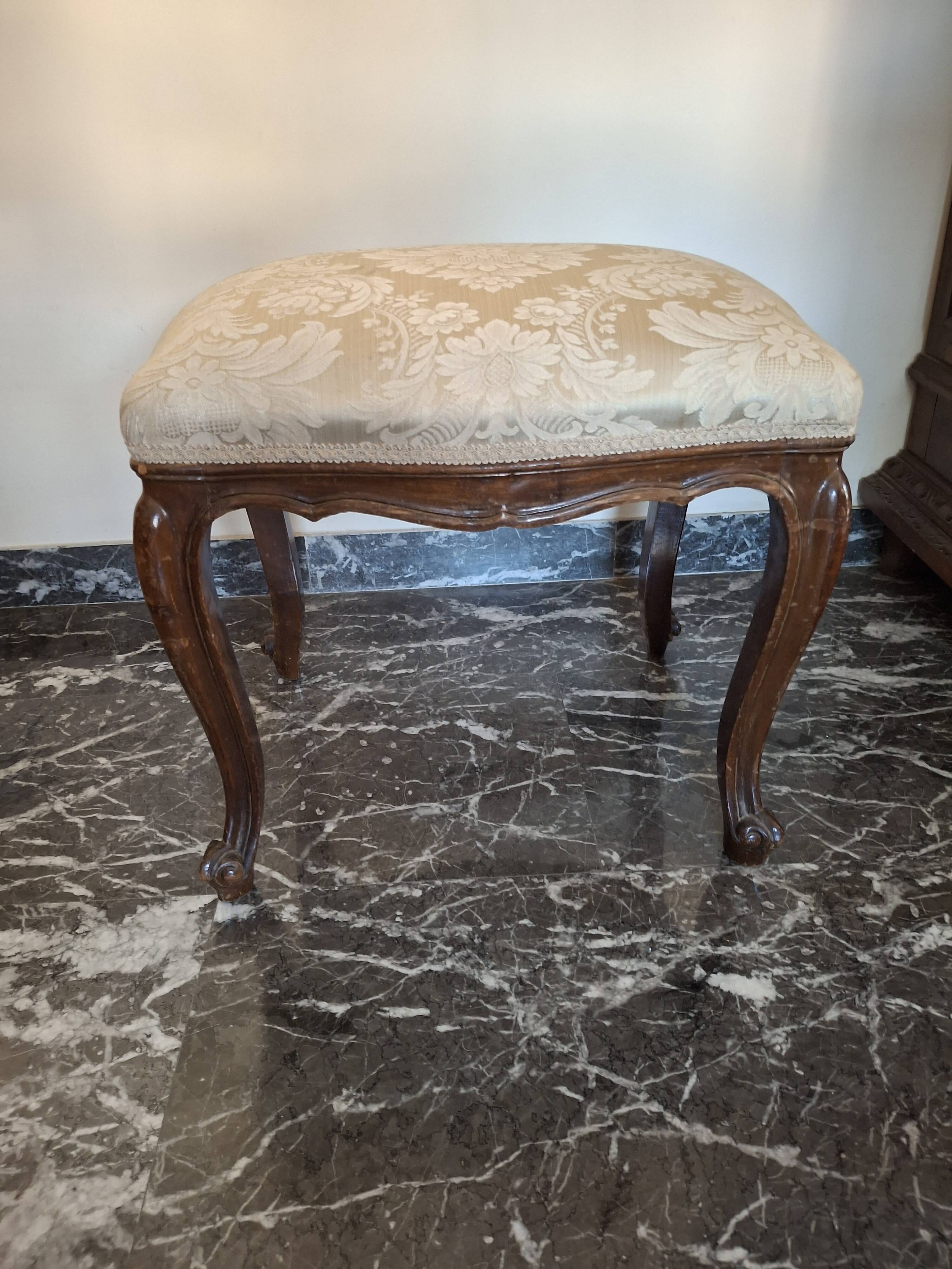 Pair of Italian armchairs from the 1960s with matching ottoman.