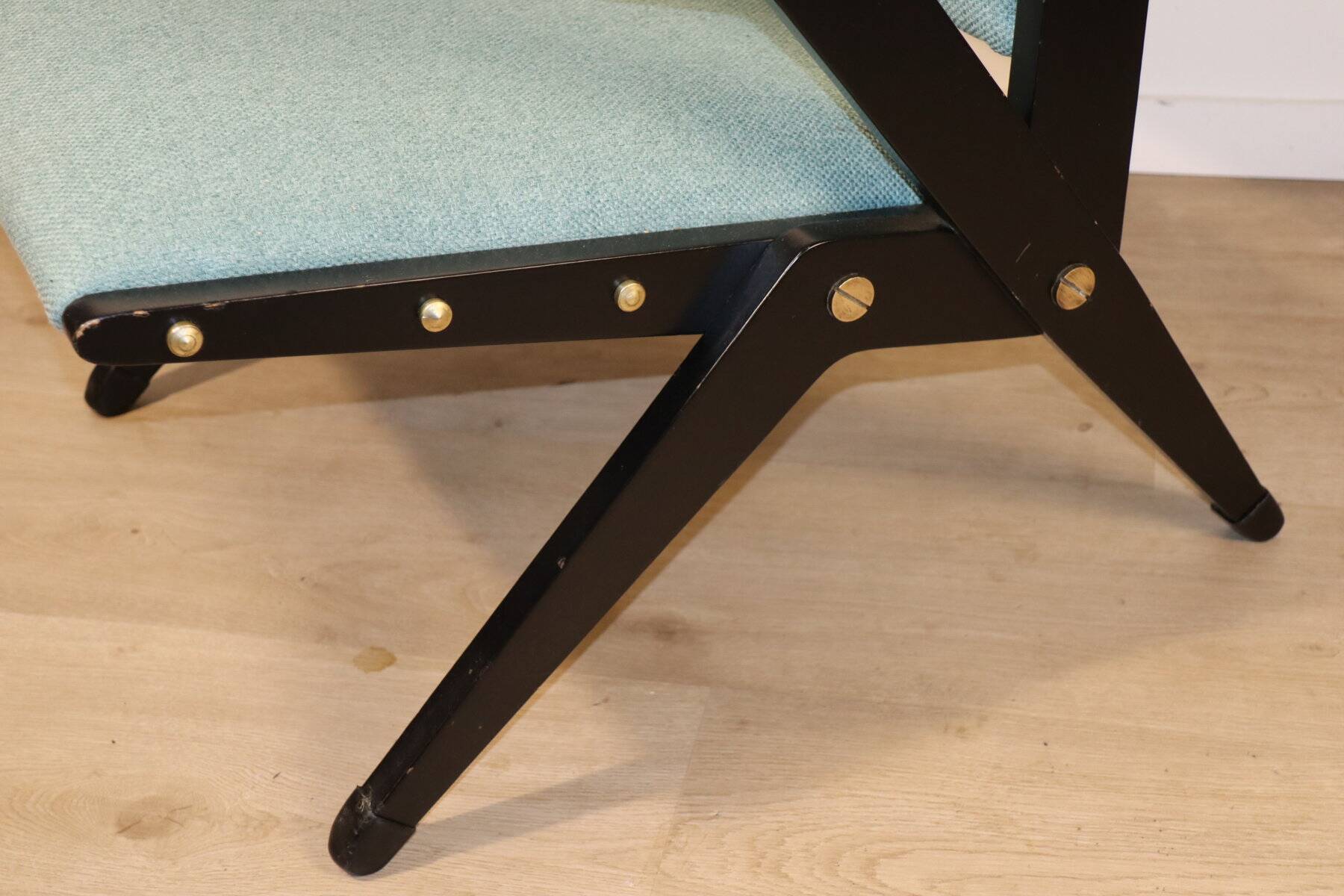 Vintage armchair from the 1960s in black wood and fabric.