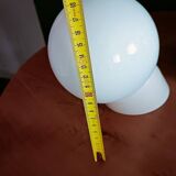 Two opaline glass globe wall lights