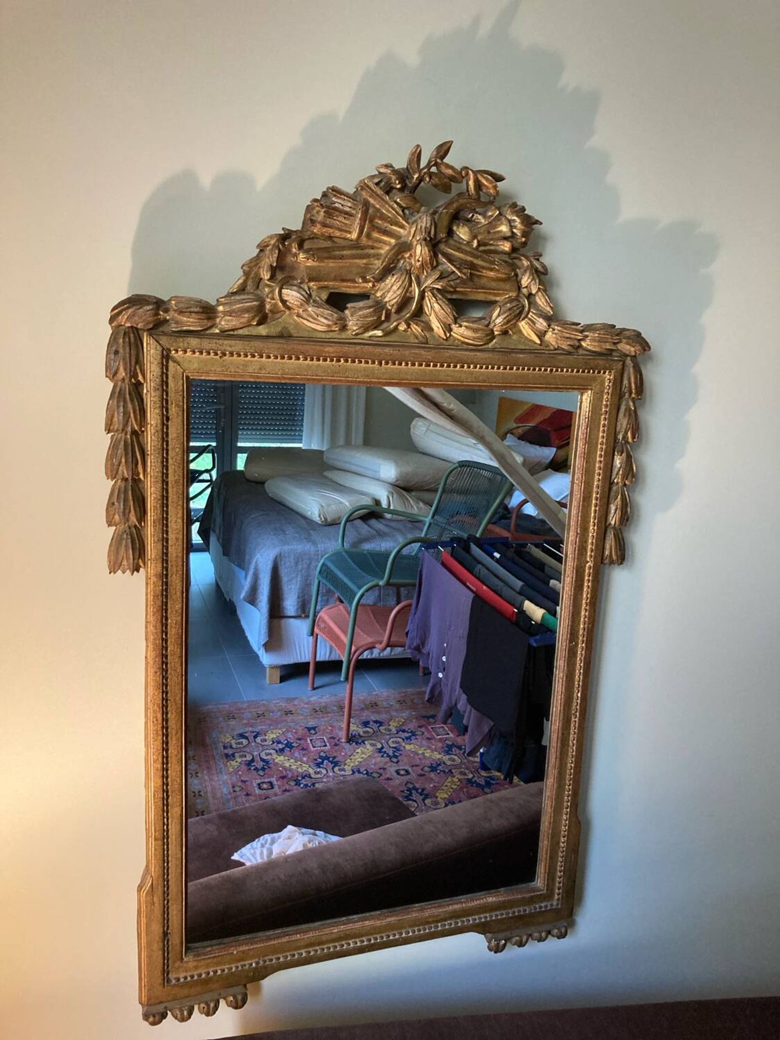 Mirror with a golden frame