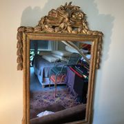 Mirror with a golden frame
