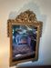 Mirror with a golden frame