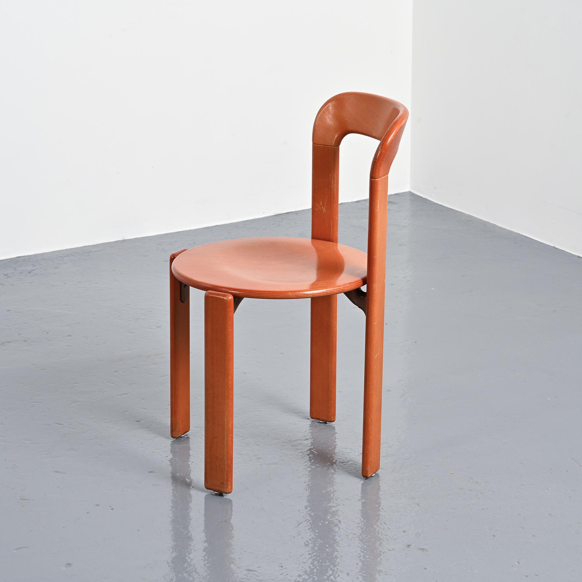 Rey chairs in stained red beech by Bruno Rey