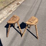 Pair of tripod farm stools in turned wood