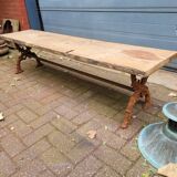 French country style cast iron garden bench with old barn wood plank