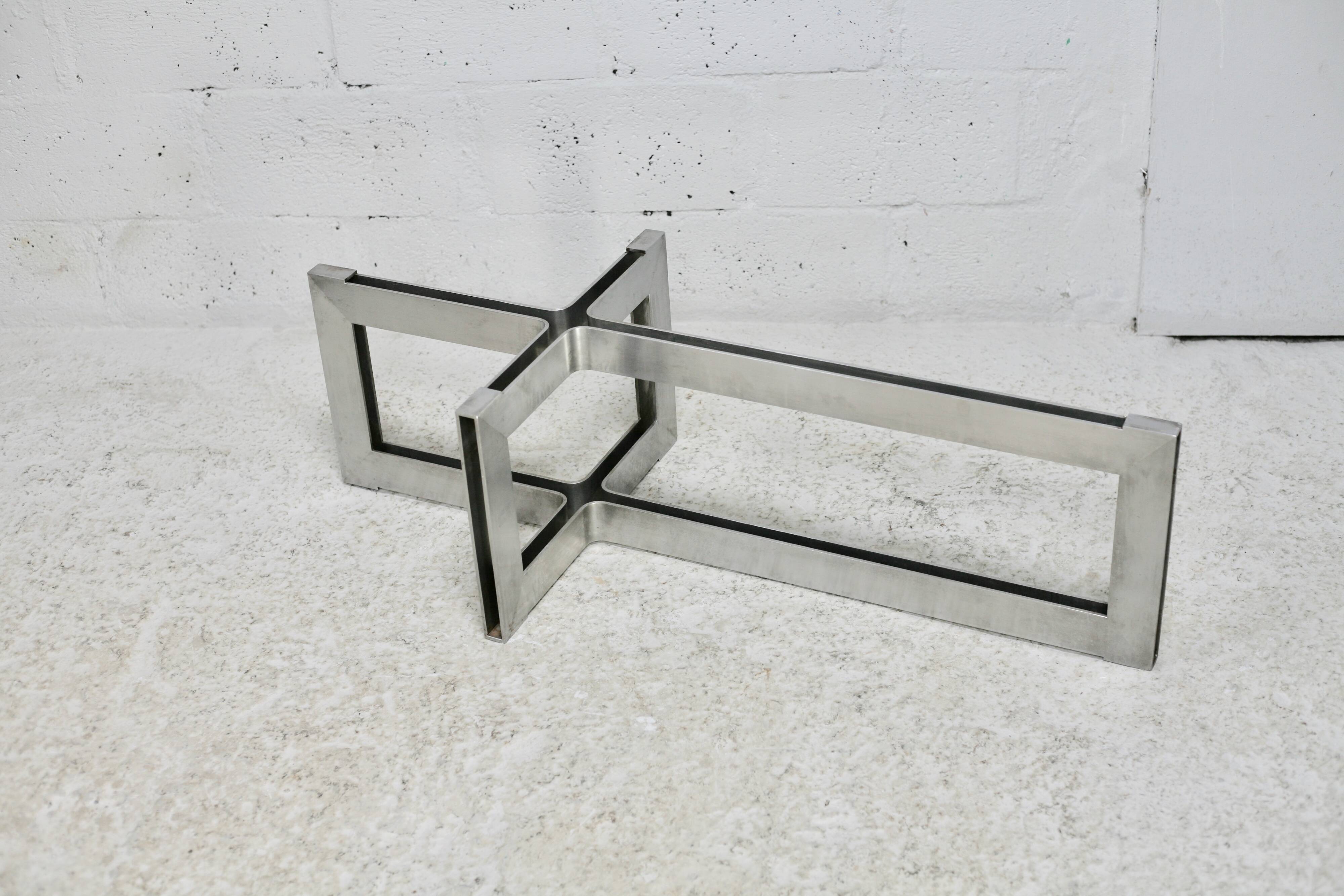 Coffee table with steel base and smoked glass slab. Circa 197