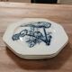 Set of three ironstone plates decorated with birds.