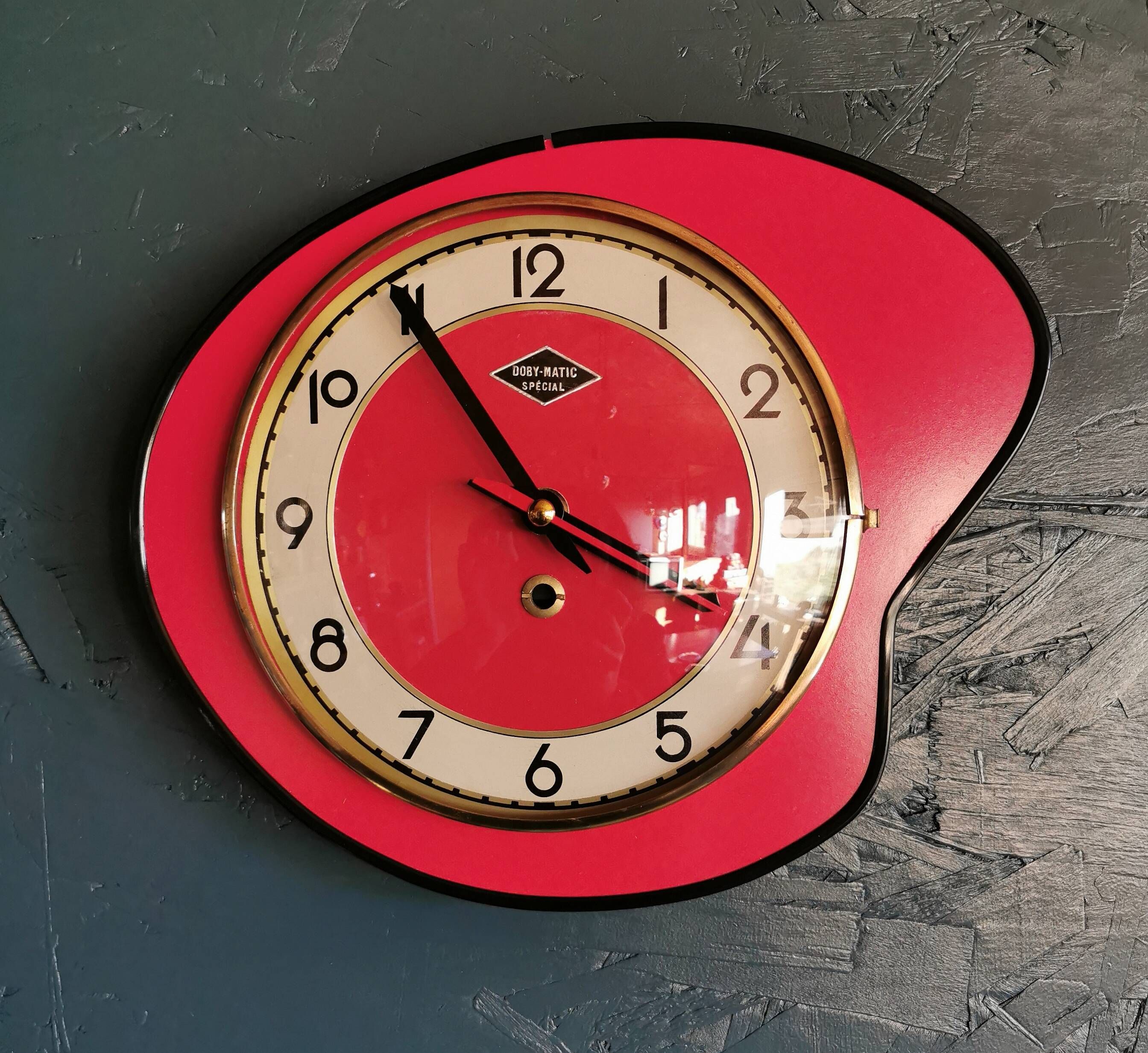 Vintage formica clock silent asymmetrical wall pendulum "Doby Matic red"