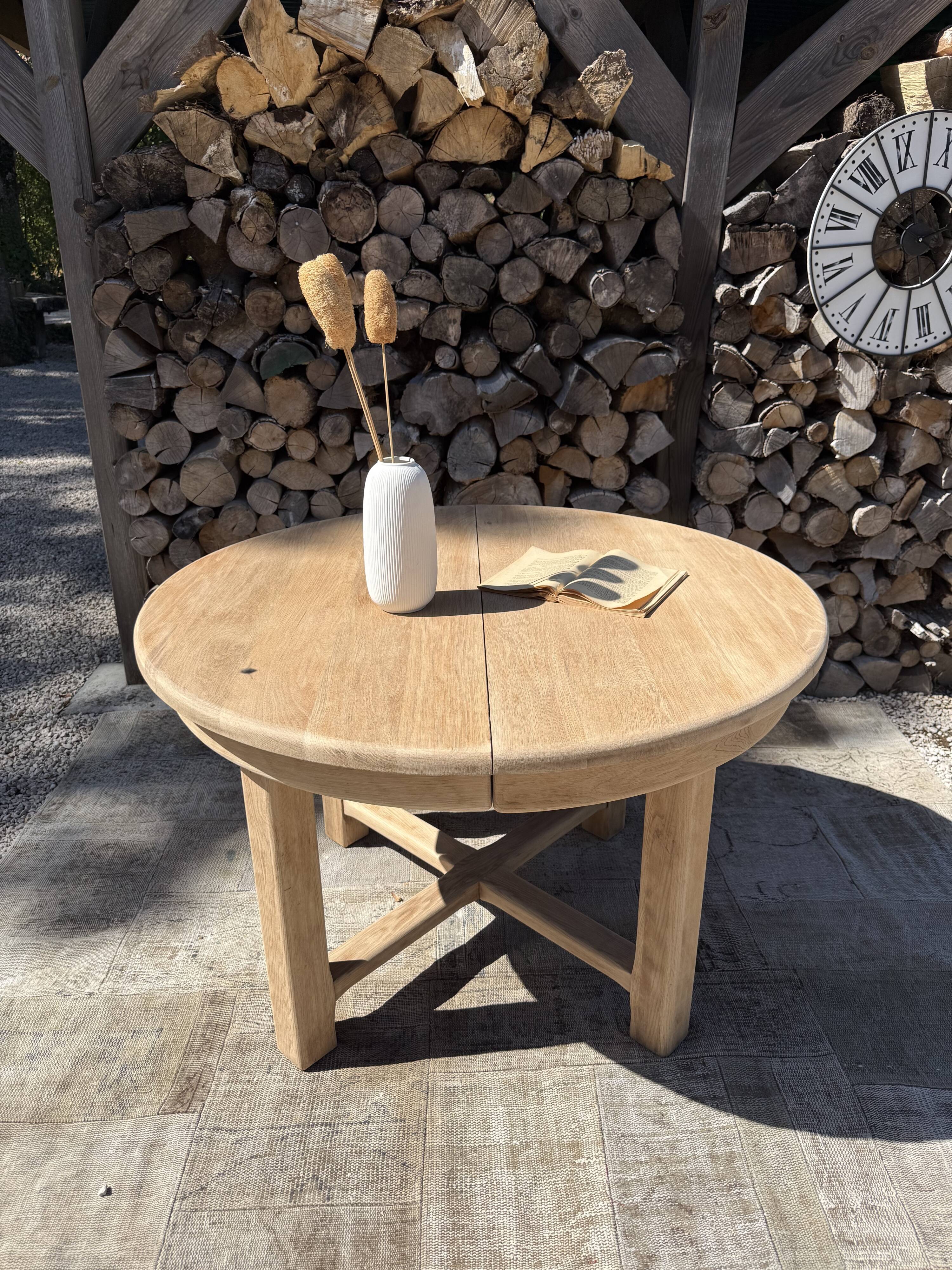 Round solid oak table with extensions, maximum 220cm.