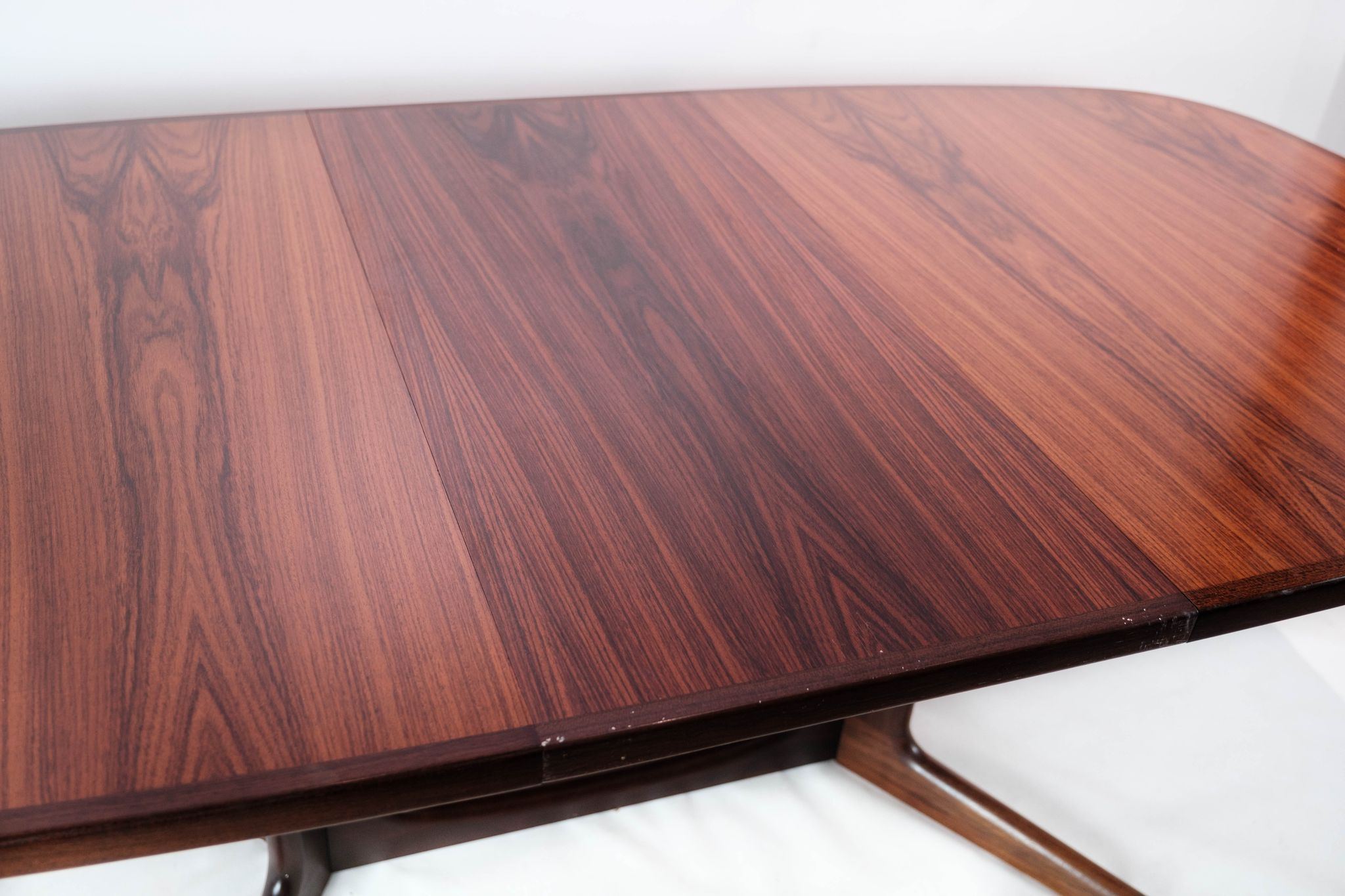 Dining table in rosewood with extensions of Danish design by Gudme Furniture, 1960s