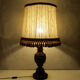 Lampe bois tourné abat jour à pompons