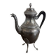 Empire style silver-plated verseuse, resting on three sculpted feet.