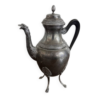 Empire style silver-plated verseuse, resting on three sculpted feet.