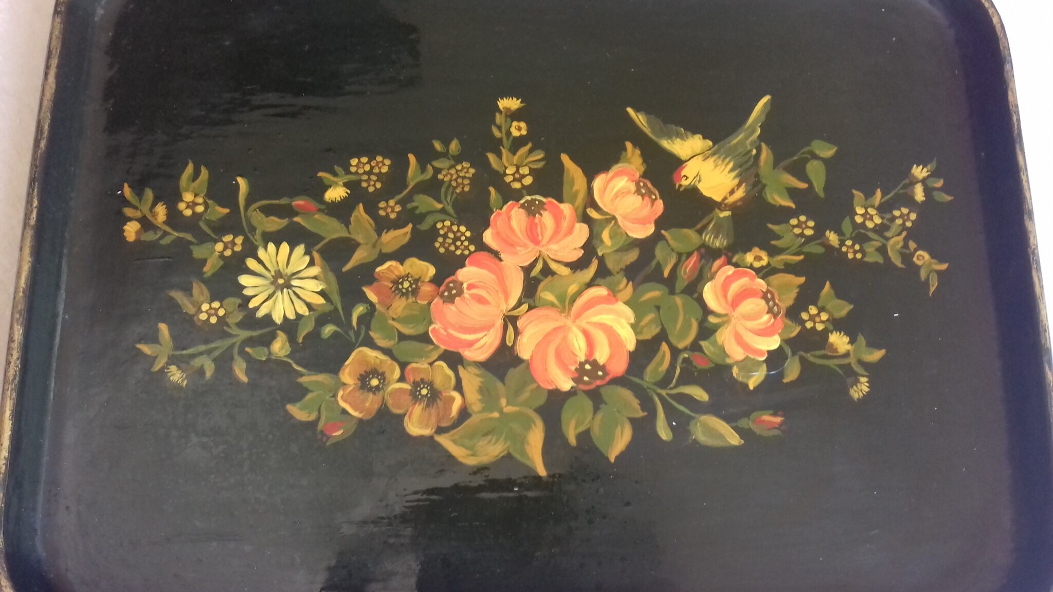 Black wooden tray with gilding and Russian motifs painted with red and green flowers