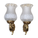 Pair of bronze wall lamps and frosted glass globe, early twentieth century.