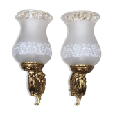 Pair of bronze wall lamps and frosted glass globe, early twentieth century.
