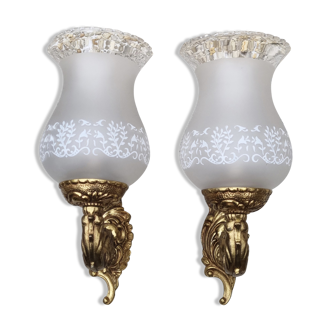 Pair of bronze wall lamps and frosted glass globe, early twentieth century.