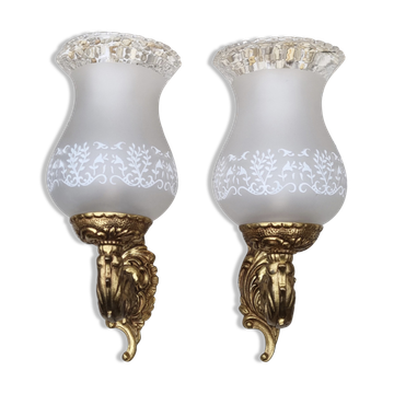 Pair of bronze wall lamps and frosted glass globe, early twentieth century.