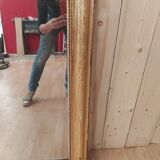 Golden Louis Philippe mirror with golden leafy