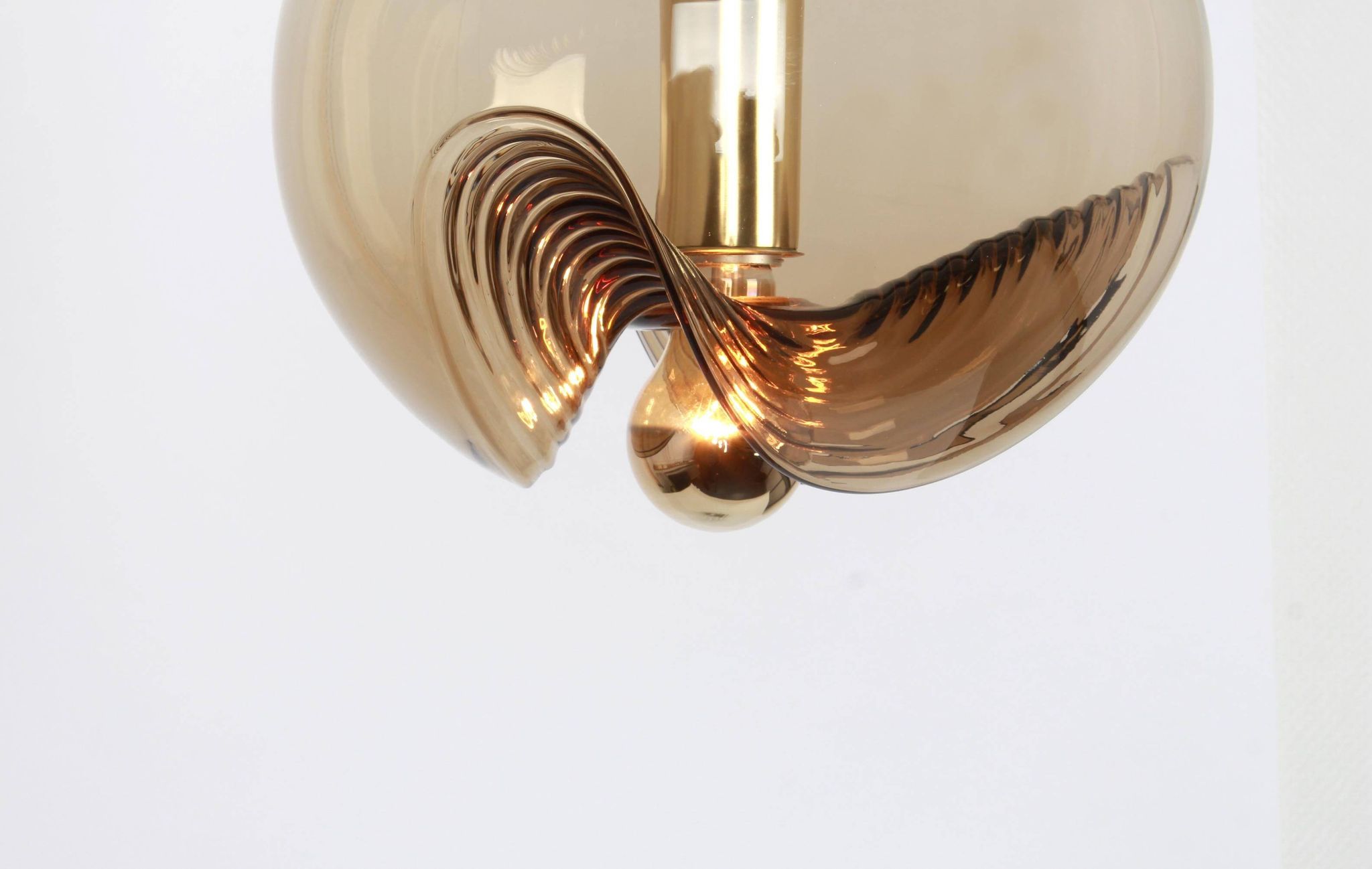 One of the four large smoked glass pendants by Peill & Putzler, Germany, 1970s.