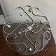 Beautiful cheese platter in glass and stainless steel with arabesques.