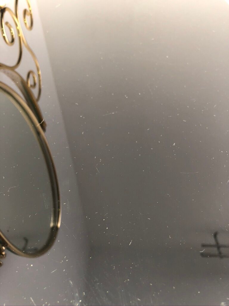 Brass hairdresser, glass and black plastic with its fluffy stool.