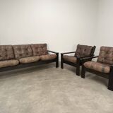 Living room sofa and brutalist armchairs in leather and wood, 70s, chalet style