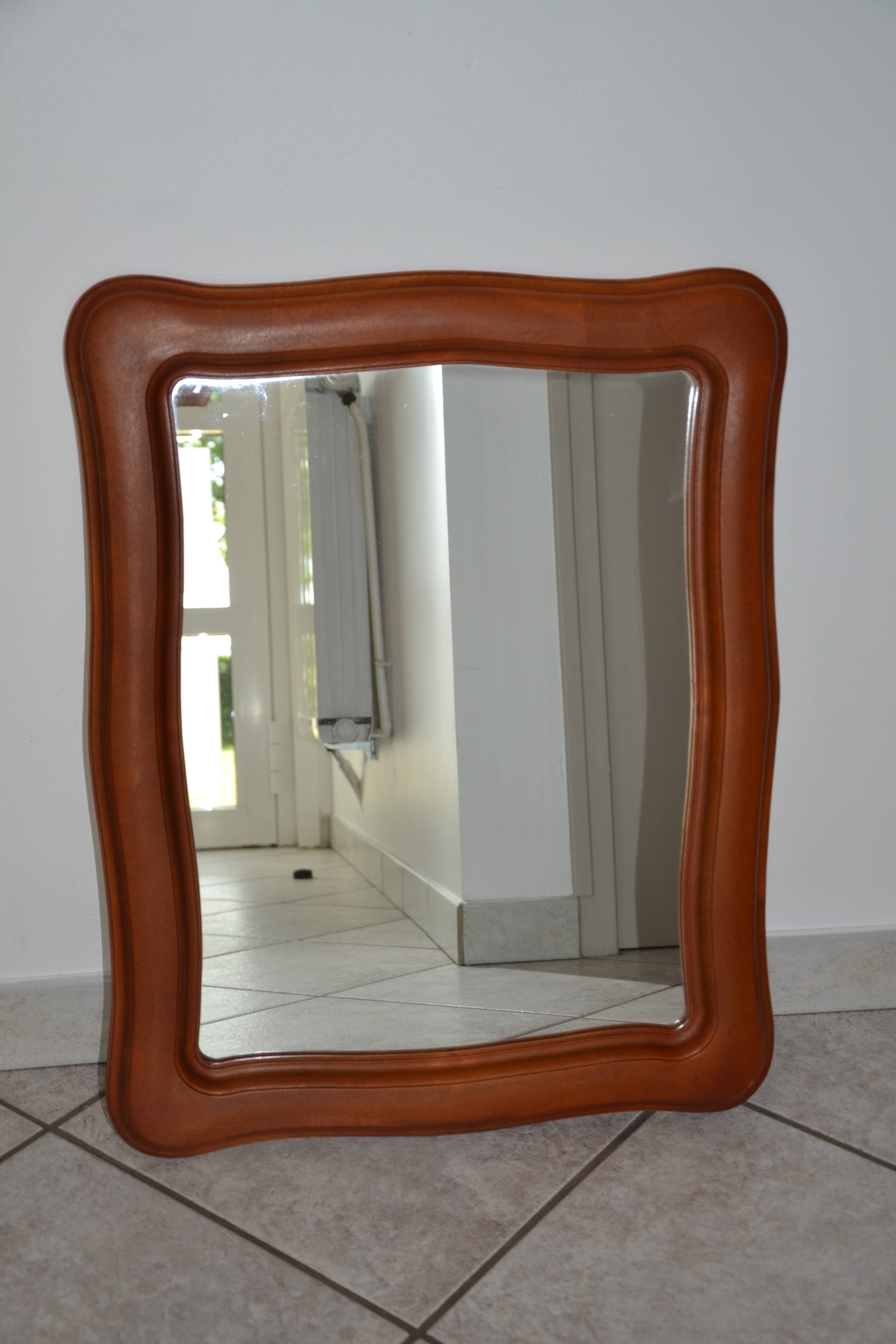 Vintage organic wavy cast resin mirror