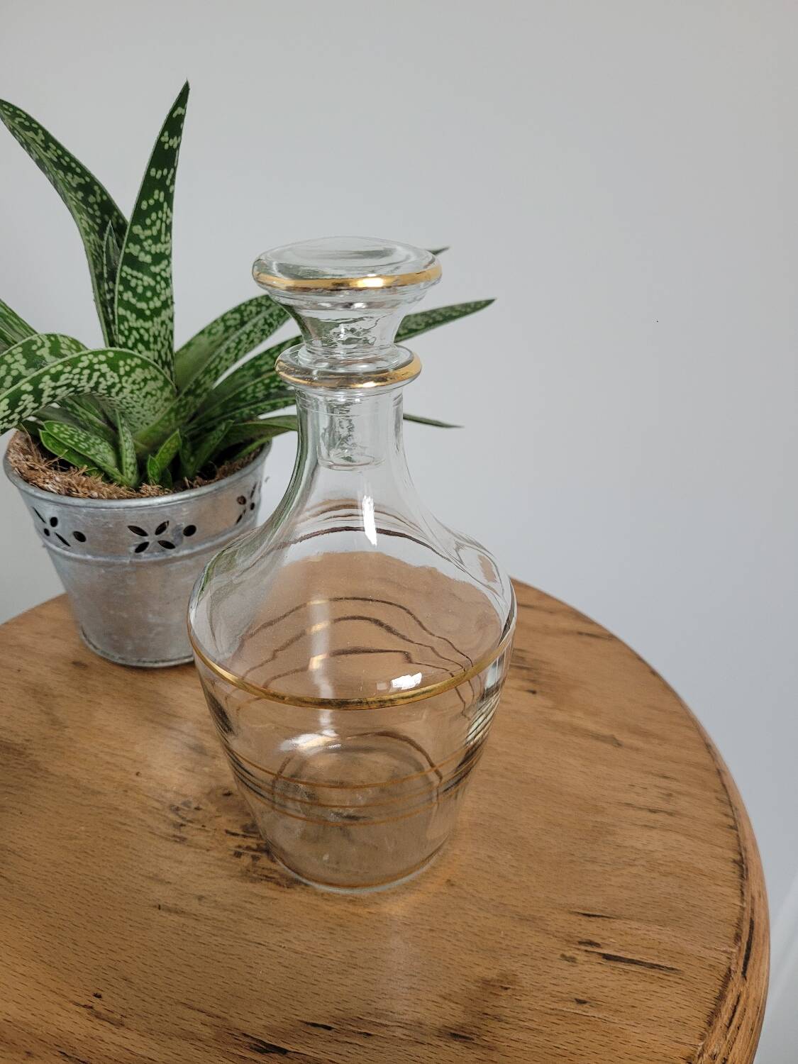 Small glass bottle with gold edges