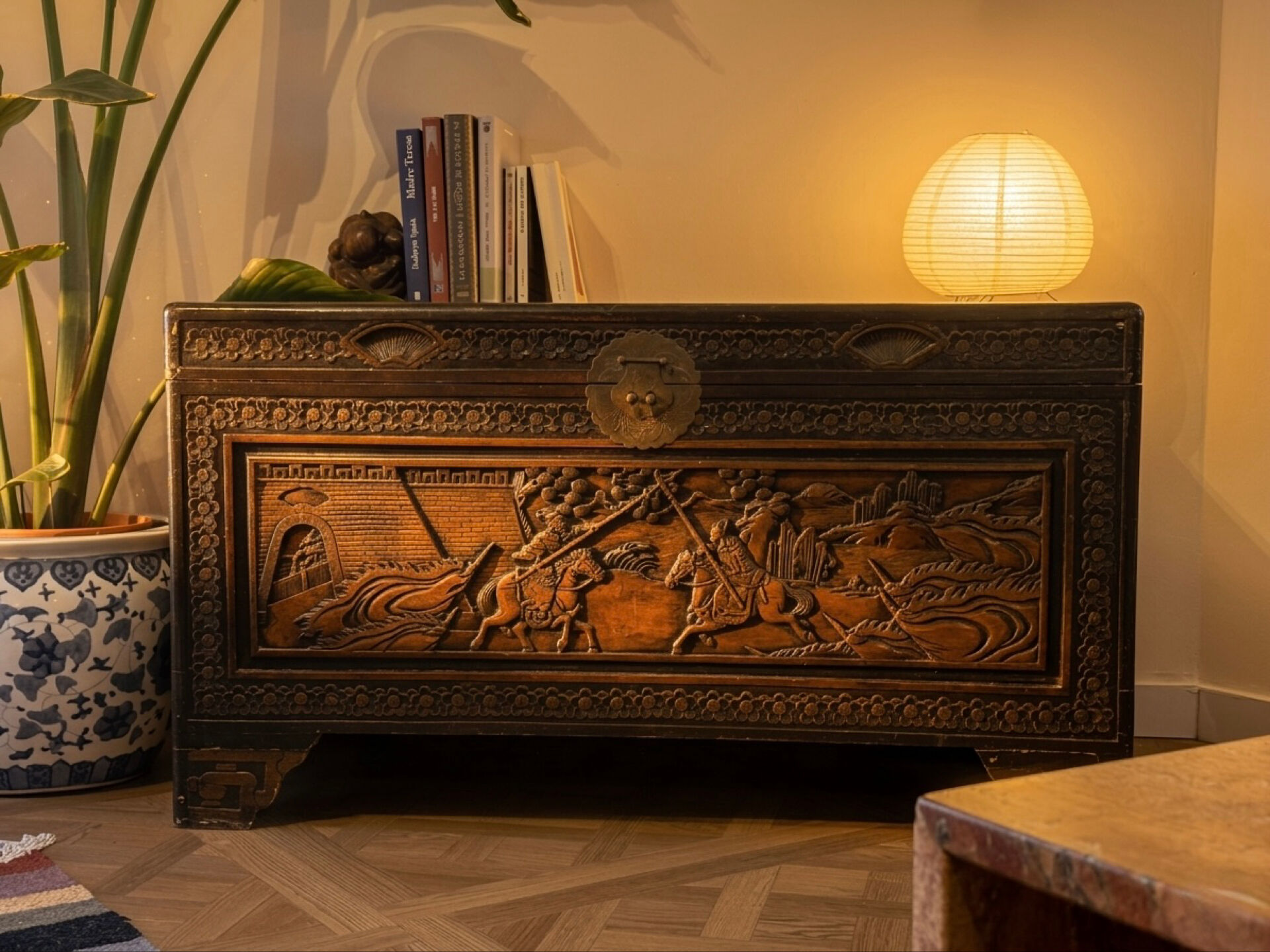 Chinese camphor wood chest, hand-carved, with rider decoration.