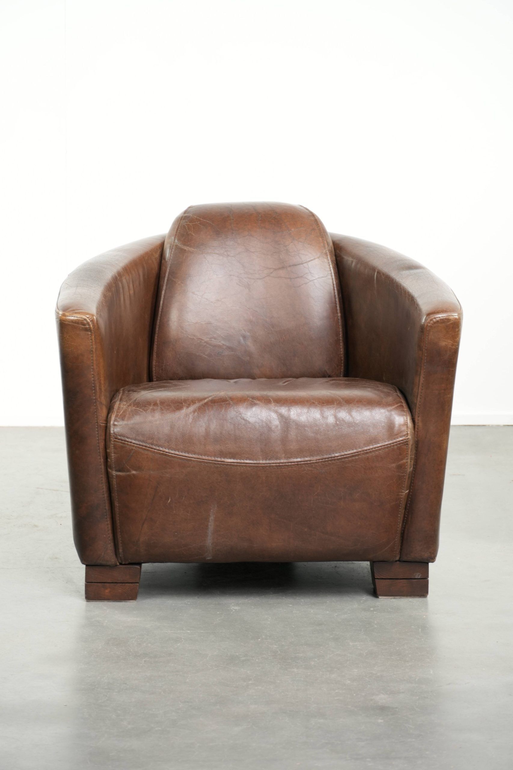 Sturdy dark cognac brown cow leather Aviator design armchair