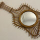 The vintage guitar rattan mirror.