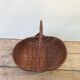Former collection in braided wicker rattan with cove decoration vintage basket