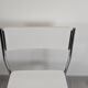 Modernist chair in chrome metal and white laminate, 1960s style.