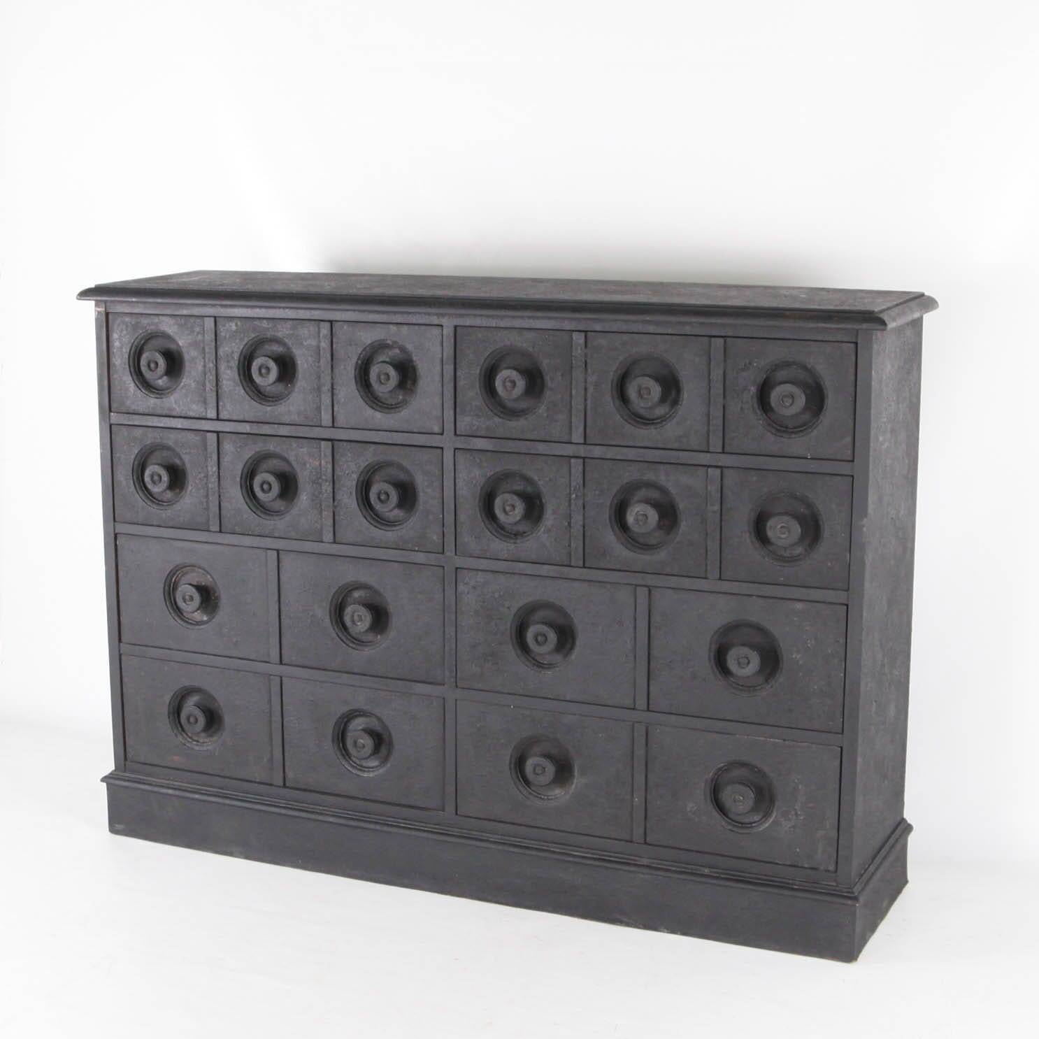 Blackened wooden chest of drawers