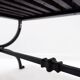 Set of 2 solid wood benches with an openwork design and wrought iron legs.
