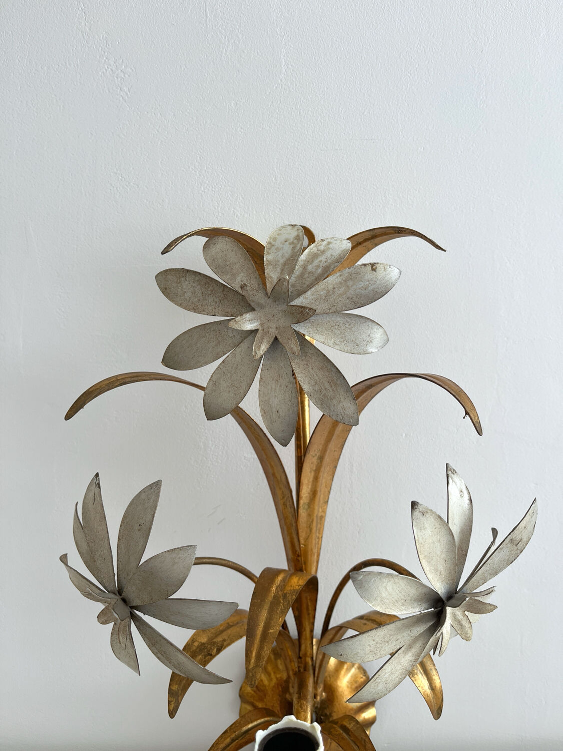 Vintage Hollywood Regency gold metal leaf wall sconce.