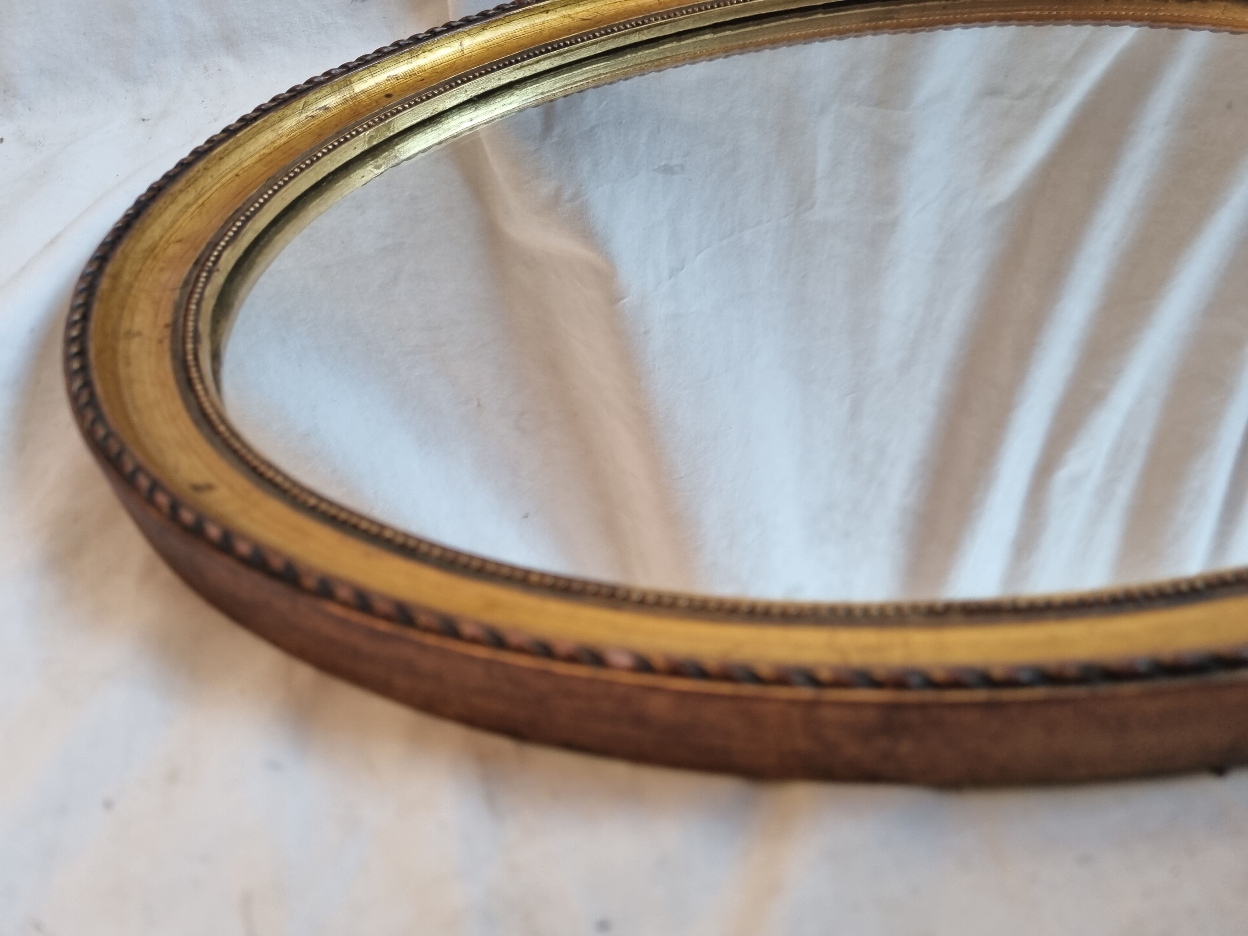 Oval mirror gilded wood, 44x34 cm