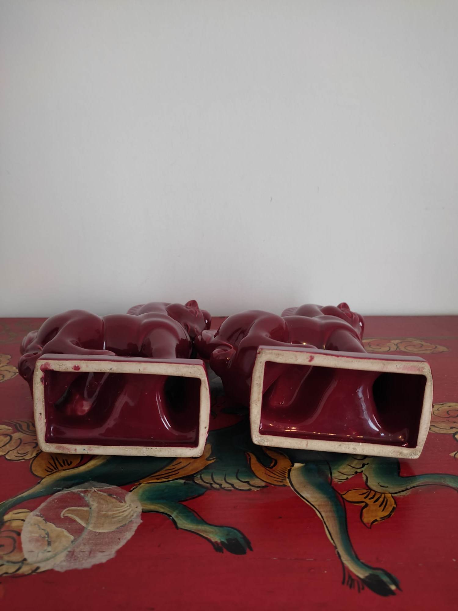 Pair of red porcelain horse bookends