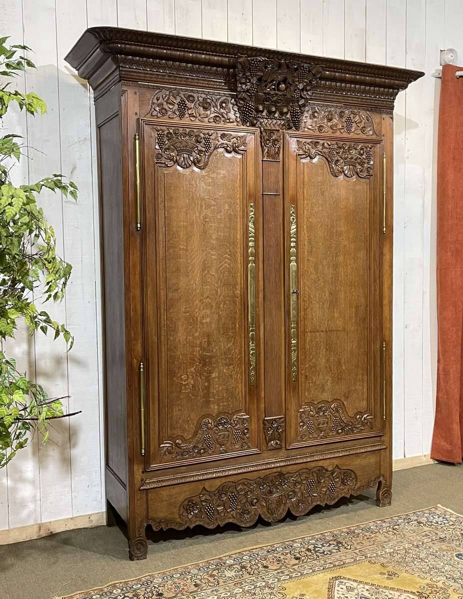 19th-century Norman wedding armoire in blonde oak.