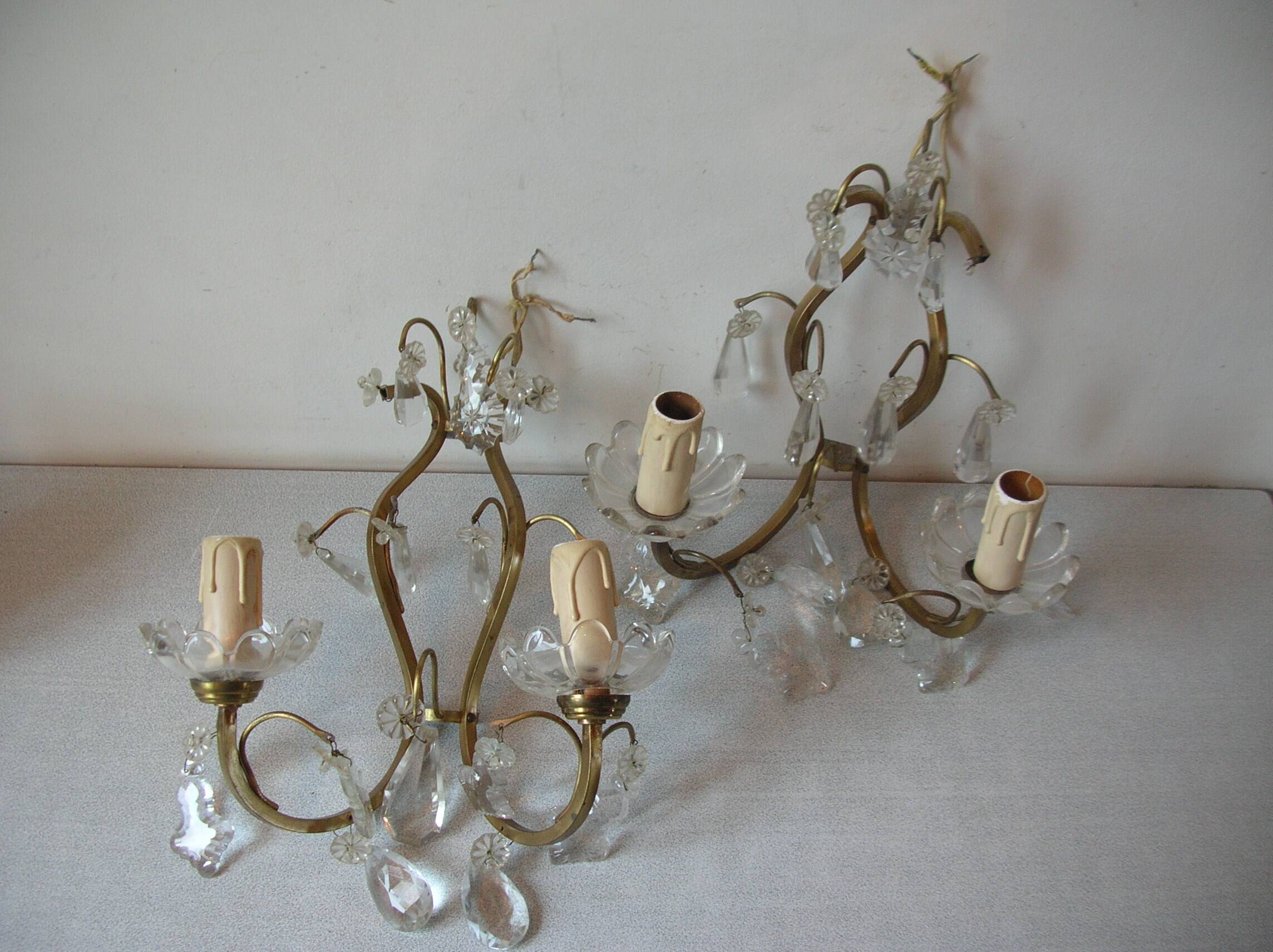 Old pair of double lamp lights with glass and brass pendants, retro decoration